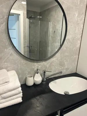a bathroom with a sink and a mirror at Flat in central of Vilnius in Vilnius