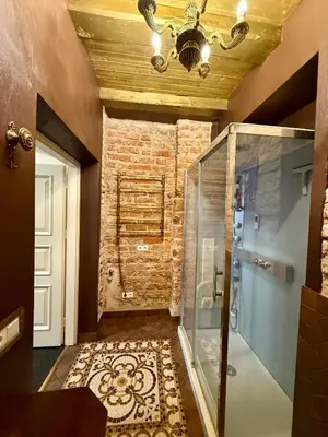 a bathroom with a shower and a glass shower stall at Pilies8 Luxury Vilnius Apartment in Vilnius