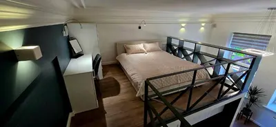 a small bedroom with a bed in a tiny house at Telegrafas25-modern apartment in the center of Kaunas in Kaunas