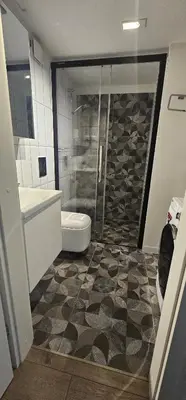 a bathroom with a shower and a toilet and a sink at Telegrafas25-modern apartment in the center of Kaunas in Kaunas