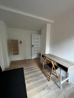 a room with a table in the middle of a room at Girios Horizontas - Mara in Trakai