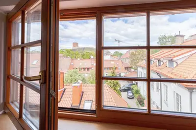 an open window with views of a city at Prestige Vilnius Old Town Apartment by Reside Baltic in Vilnius