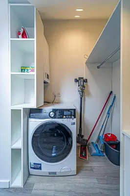 a washer and dryer in a laundry room at Symphony Apartment with free parking in Kaunas