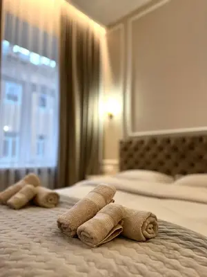 two towels on a bed in a hotel room at Old Town Residence Kaunas in Kaunas