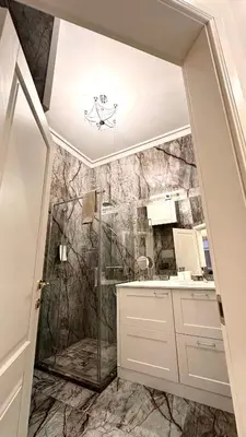 a bathroom with a shower with a glass door at Old Town Residence Kaunas in Kaunas