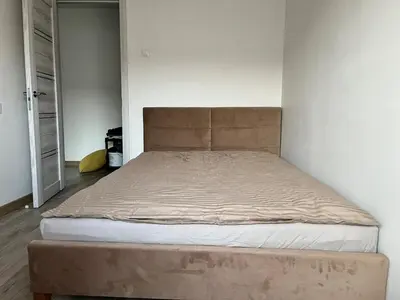 a bed in a bedroom with a large mattress at Very quiet and cozy place in Vilnius