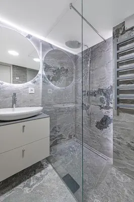 a bathroom with a glass shower and a sink at RADIO CITY Loft 345 by Domvia in Kaunas