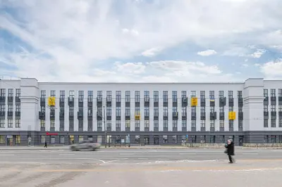 a large white building with a car in front of it at RADIO CITY Loft 345 by Domvia in Kaunas