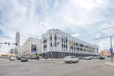 a busy city street with a white building and cars at RADIO CITY Loft 345 by Domvia in Kaunas