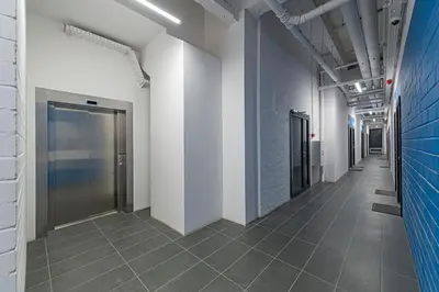 a hallway of an office building with a elevator at RADIO CITY Loft 435 by Domvia in Kaunas