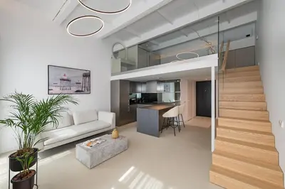 a living room with a couch and a table at RADIO CITY Loft 435 by Domvia in Kaunas
