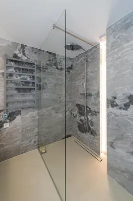 a shower with a glass door in a bathroom at RADIO CITY Loft 435 by Domvia in Kaunas