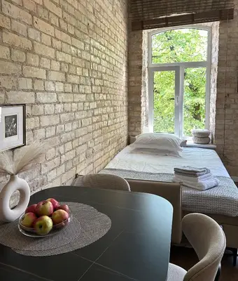 a room with a table with fruit on it at Studio in Oldtown in Vilnius