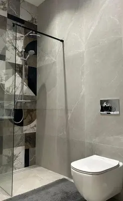 a bathroom with a toilet and a glass shower at Studio in Oldtown in Vilnius