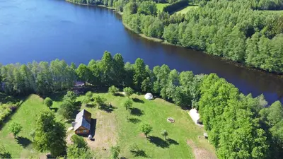 an aerial view of a house next to a river at Kiauklių oazė in Kiaukliai
