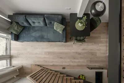 a living room with a couch and a table at Loft 62 in Vilnius
