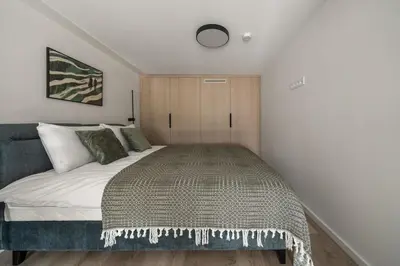 a bedroom with a large bed in a room at Loft 62 in Vilnius