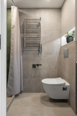 a bathroom with a toilet and a shower at Loft 62 in Vilnius