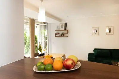 a plate of fruit on a table in a living room at Apartment with big terrace in Vilnius