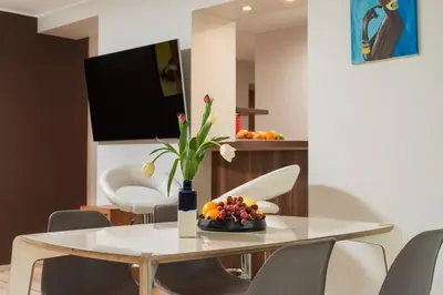 a dining room with a table and chairs at Apartment with big terrace in Vilnius