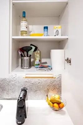 a kitchen with a counter top with a kitchen appliance at Cozy 1BR in Old Town with FREE Parking in Vilnius