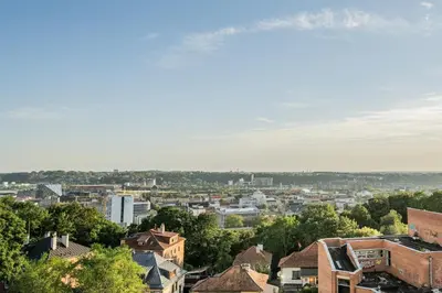 a view of a city with trees and buildings at Radio Apartment in Kaunas