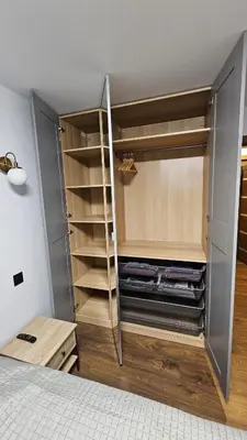 a room with a closet with wooden floors and shelves at CITY STAY 2-bedroom apartment in Šiauliai