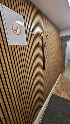 a wooden wall with a no smoking sign on it at CITY STAY 2-bedroom apartment in Šiauliai