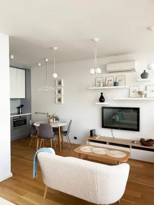 a living room with a couch and a table at Cozy Vilnius Stay in Vilnius