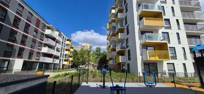 an empty playground in front of a building at NEW Bright & Stylish 2BR apt in Vilnius