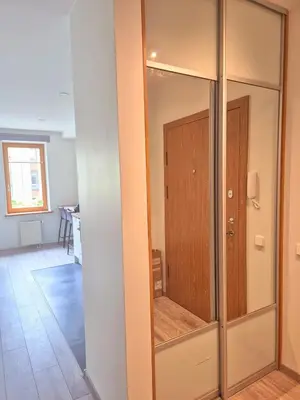 a room with a closet with a glass door at Sv2 Marie Oldtown SELF CHECK-IN by QuarterStays in Vilnius