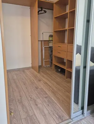 a room with a closet and a wooden floor at Sv2 Marie Oldtown SELF CHECK-IN by QuarterStays in Vilnius