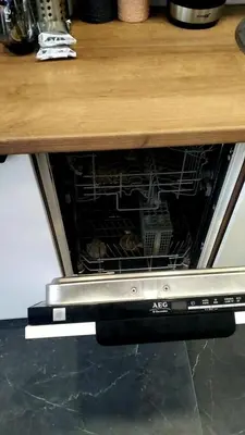 an oven with its door open under a counter at Sv2 Marie Oldtown SELF CHECK-IN by QuarterStays in Vilnius