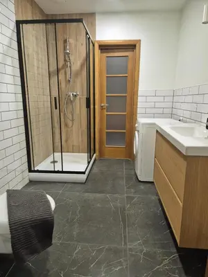 a bathroom with a shower and a sink at Sv2 Marie Oldtown SELF CHECK-IN by QuarterStays in Vilnius