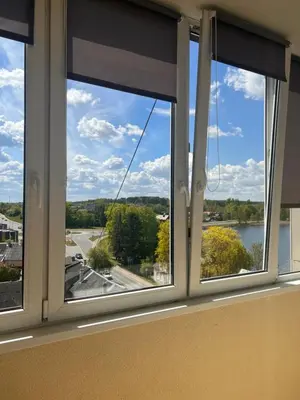 a window in a room with a view of a lake at Butas Trakuose su vaizdu į ežerus-Lake view apartment in Trakai in Trakai