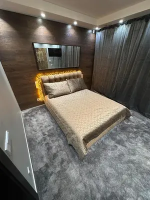 a bedroom with a bed and a mirror on the wall at B&M Romantic room Self check-in in Vilnius