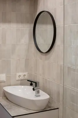 a bathroom with a sink and a mirror on the wall at Rasota Pieva Dewy Meadow