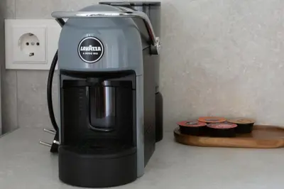 a coffee maker sitting on top of a counter at Rasota Pieva Dewy Meadow