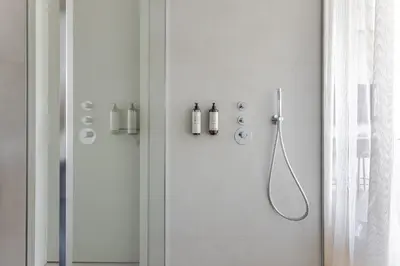 a shower in a white bathroom with a shower at Luxury Honey Moon Apartments with Free Underground Parking in Kaunas