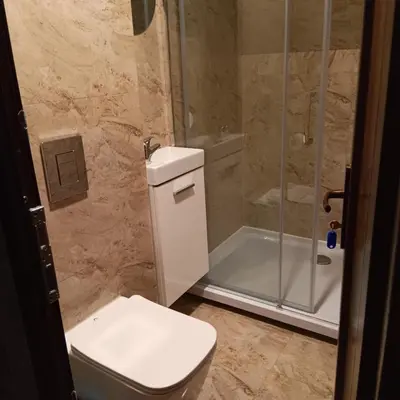 a bathroom with a toilet and a shower at Valva vila in Luokesos Sen
