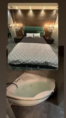a bath tub in a bedroom with a bed at B&M Mini jecuzzi Lovers room Self check-in in Vilnius