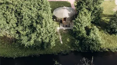 an aerial view of a house with a dome at Intimate Peaceful Yurt Surrounded by Nature in Lithuania in Jundeliškės