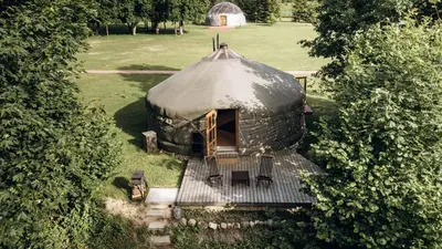an aerial view of a yurt in a field at Intimate Peaceful Yurt Surrounded by Nature in Lithuania in Jundeliškės