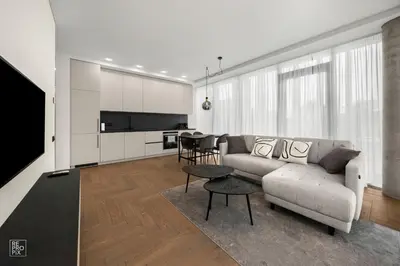 a living room with a couch and a table at Comfortable 2 BD Apartment by Domvia in Kaunas