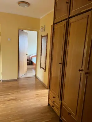 an empty room with a closet and a bedroom at Butas prie tvenkinio in Varėna
