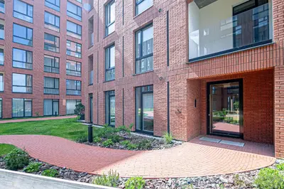 a brick building with a large door in front of it at River View Apartment with free parking in Kaunas