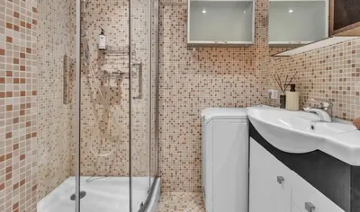 a bathroom with a shower and a sink at Vilnius Old Town Amber Penthouse in Vilnius
