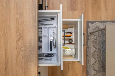 an open refrigerator filled with lots of tools at Apartment Lampėdis by Polo Apartments in Kaunas