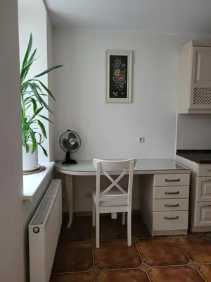 a white desk with a chair in a kitchen at Maironio 21A apartments - City center - Free parking in Kaunas