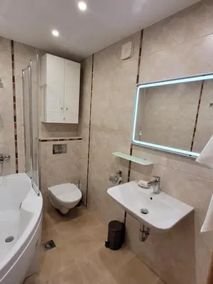 a bathroom with a white sink and a toilet at Maironio 21A apartments - City center - Free parking in Kaunas